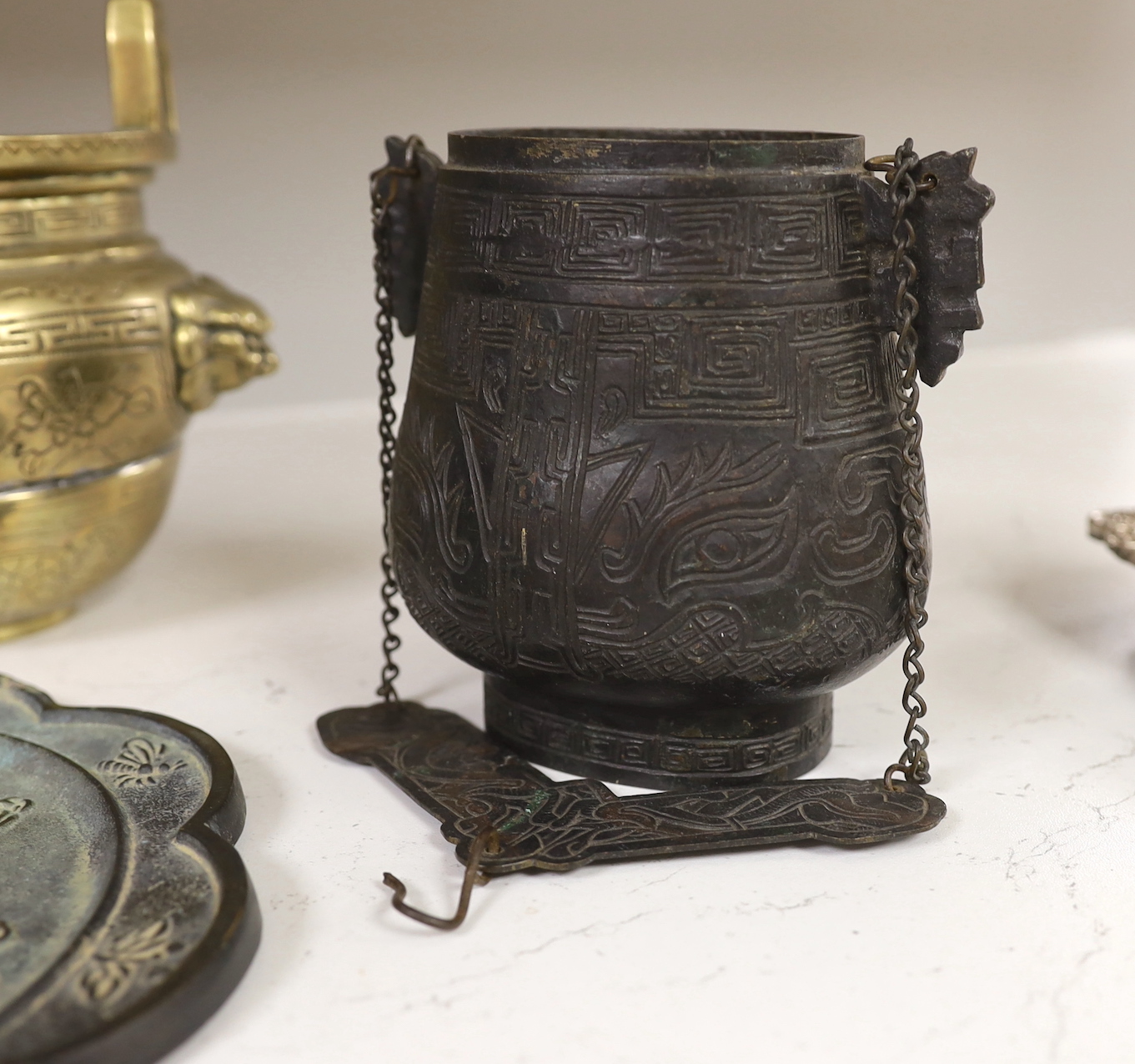 Two Chinese bronze vessels, a bronze censer, a vajra and a bronze mirror, tallest 16cm high